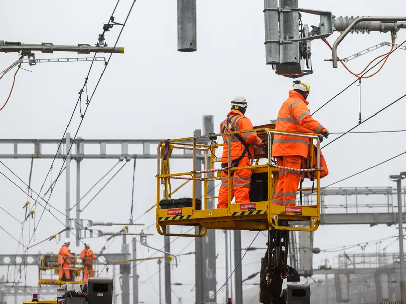 Engineers working on overhead line electrification equipment