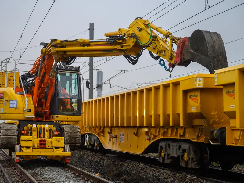 On-track plant lifting ballast wagons during a rail renewal